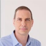 person in blue shirt headshot